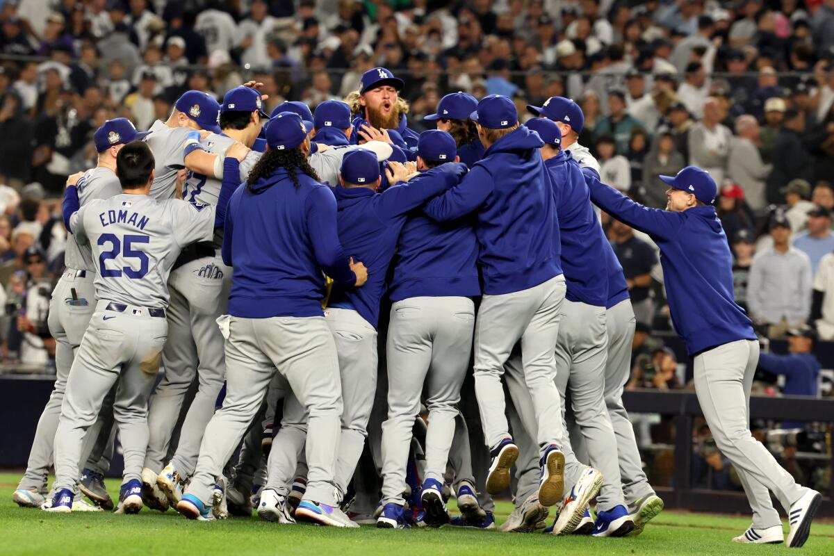 Dodgers players gather together to celebrate winning the World Series.
