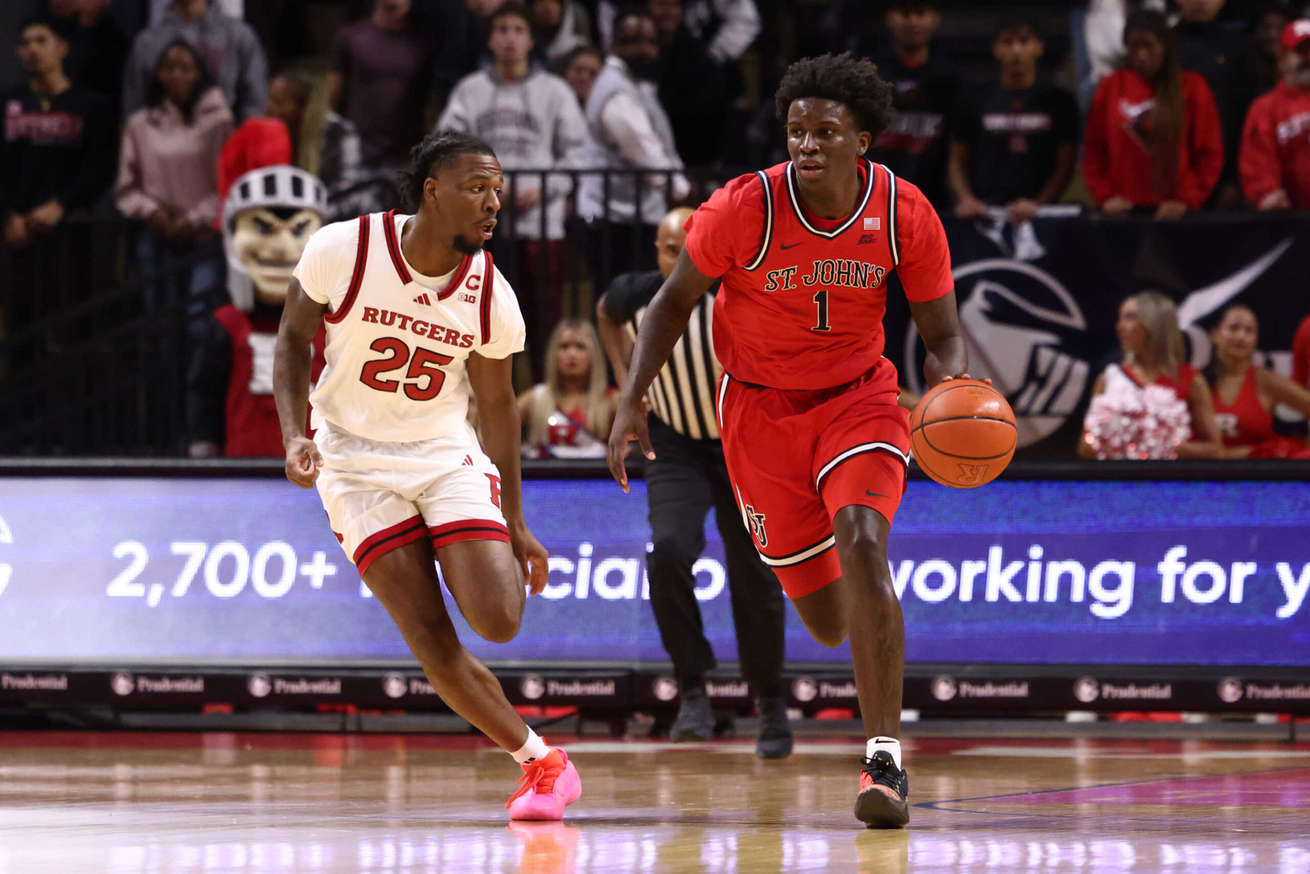 PISCATAWAY, NEW JERSEY - OCTOBER 17: Kadary Richmond #1 of the St. John's Red Storm dribbles the ball while being defended by Jeremiah Williams #25 of the Rutgers Scarlet Knights during the first half at Jersey Mike's Arena on October 17, 2024 in Piscataway, New Jersey. (Photo by Ed Mulholland/Getty Images)