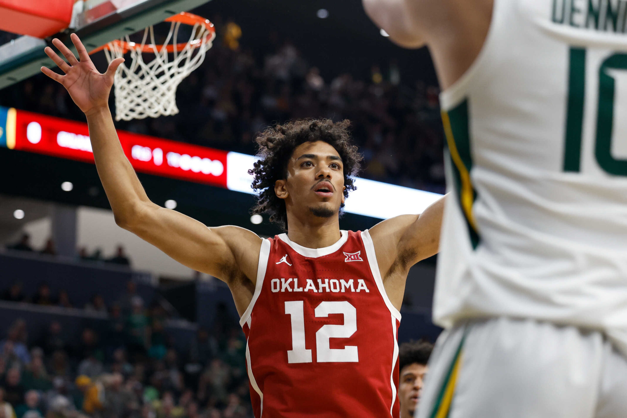 WACO, TX - FEBRUARY 13: Oklahoma Sooners guard Milos Uzan (12) holds his arms out to guard against an inbounds play by Baylor Bears guard RayJ Dennis (10) during the Big 12 college basketball game between Baylor Bears and Oklahoma Sooners on February 13, 2024, at Foster Pavilion in Waco, Texas. (Photo by David Buono/Icon Sportswire via Getty Images)