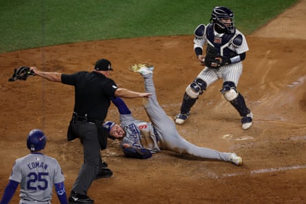 Gavin Lux of the Los Angeles Dodgers slides in safe to home past Jose Trevino of the New York Yankees in the sixth inning of Monday night’s Game 3 of the World Series.