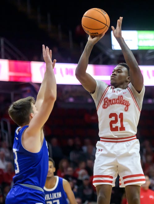 Bradley's Duke Deen, right, shoots over the Millikin defense in the first half of their college basketball exhibition game Wednesday, Oct. 30, 2024 at the Peoria Civic Center. The Braves defeated the Big Blue 80-63.