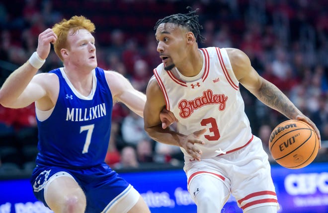 Bradley's Zek Montgomery moves against Millikin's Lane Thomann in the first half of their college basketball exhibition game Wednesday, Oct. 30, 2024 at the Peoria Civic Center. The Braves defeated the Big Blue 80-63.