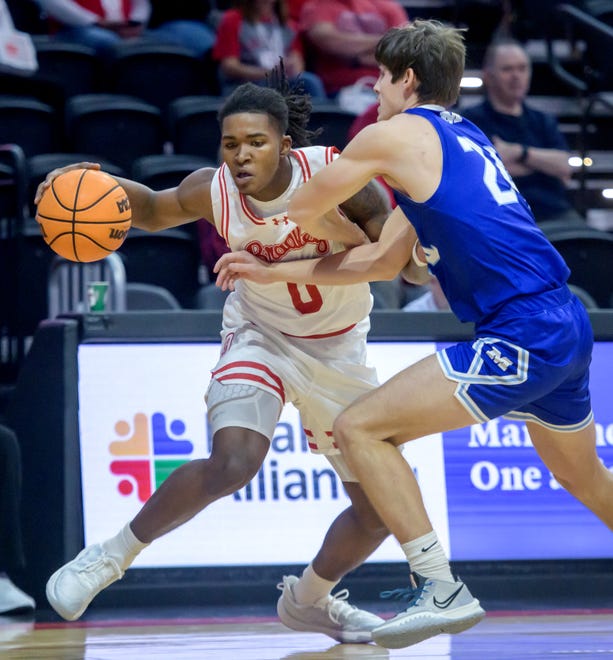 Bradley's Demarion Burch (0) tangles with Millikin's Chase Travis in the first half of their college basketball exhibition game Wednesday, Oct. 30, 2024 at the Peoria Civic Center. The Braves defeated the Big Blue 80-63.
