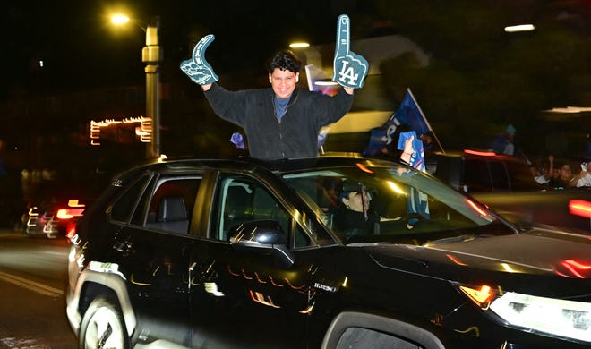 Los Angeles Dodgers fans celebrate winning the World Series.