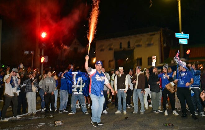 Los Angeles Dodgers fans celebrate winning the World Series.