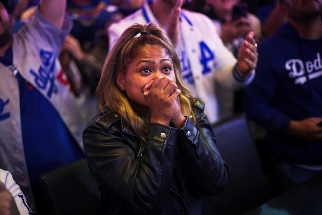 A fan reacts as the Los Angeles Dodgers win the World Series.