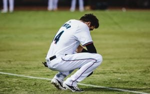 Baseball player in a white uniform with number 