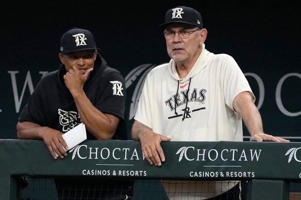 Rangers associate Manager Will Venable and manager Bruce Bochy watch play during the first inning against the Dodgers at Globe Life Field on July 22, 2023 in Arlington, Tex. (Sam Hodde/Getty Images)