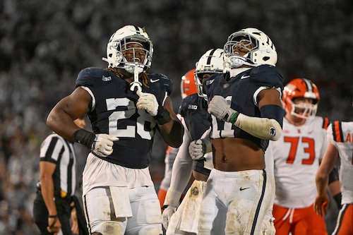 Penn State defensive tackle Zane Durant (28) celebrates with Abdul Carter (11) after sacking Illinois quarterback Luke Altmyer (9) during the fourth quarter of an NCAA college football game, Saturday, Sept. 28, 2024, in State College, Pa.