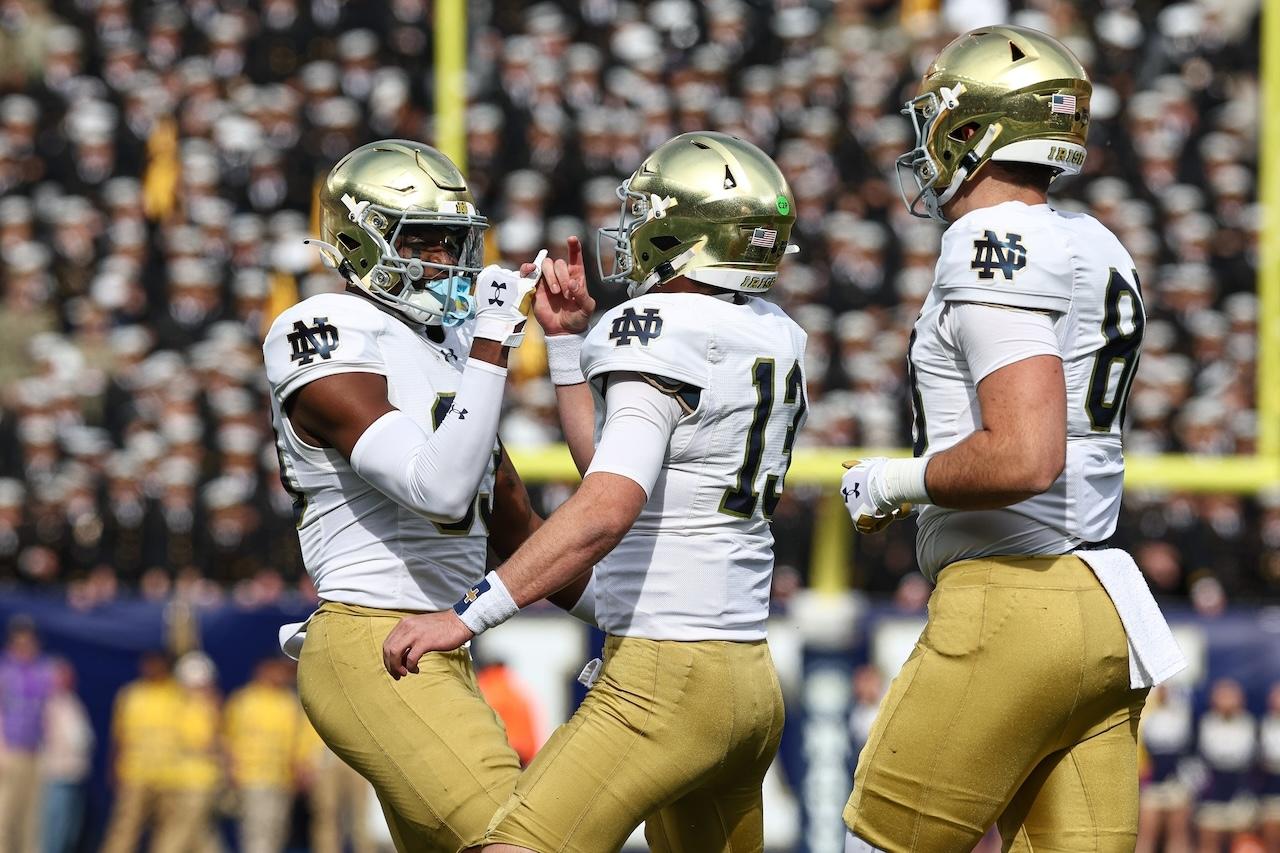 Notre Dame players celebrate against Navy.