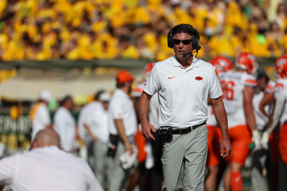 WACO, TX - OCTOBER 26: Oklahoma State Cowboys head coach Mike Gundy walks onto the field to check on an injured player during the Big 12 college football game between Baylor Bears and Oklahoma State Cowboys on October 26, 2024, at McLane Stadium in Waco, TX.  (Photo by David Buono/Icon Sportswire via Getty Images)