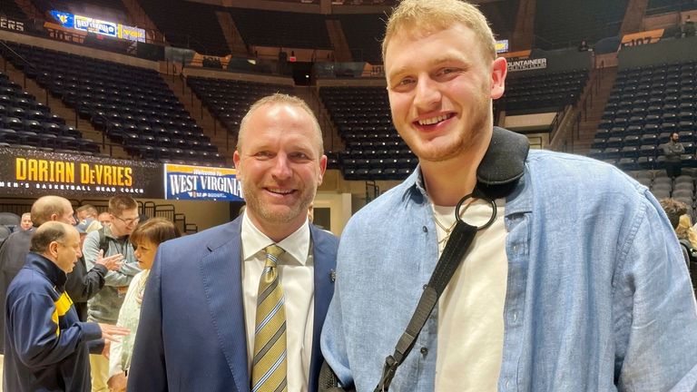 West Virginia men's NCAA college basketball coach Darian DeVries poses...