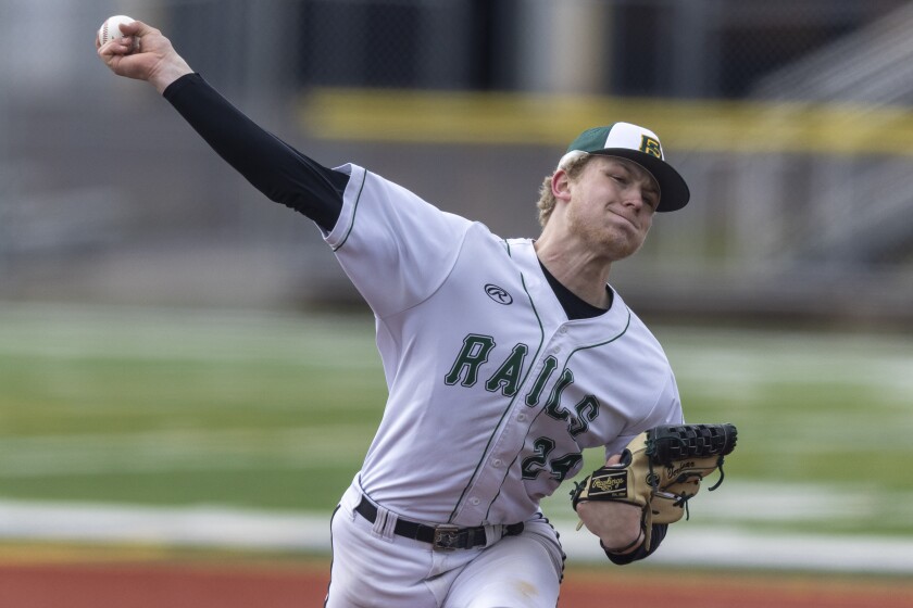 high school boys play baseball