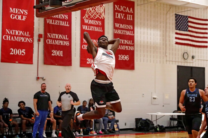 Central Lakes College's Jaiquavious Ackey dunks the ball during a scrimmage between CLC and Itasca on Monday, Oct. 28, 2024, in Brainerd.