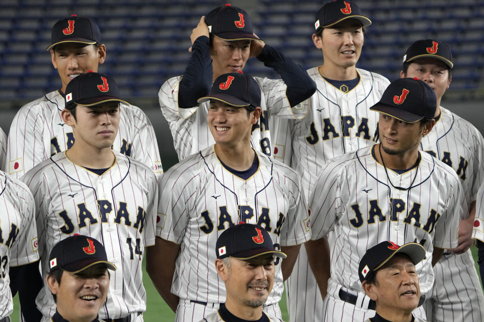 Japan's Shohei Ohtani, center, Yu Darvish, right, and Roki Sasaki, left, pose for a team photo, a day before their Pool B game against China at the World Baseball Classic (WBC) in Tokyo, Japan, Wednesday, March 8, 2023. (AP Photo/Shuji Kajiyama)