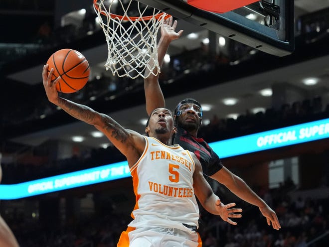 Tennessee guard Zakai Zeigler (5) goes for the basket while guarded by Gardner-Webb guard Anthony Selden (1) during an NCAA college basketball game on Monday, Nov. 4, 2024, in Knoxville, Tenn.