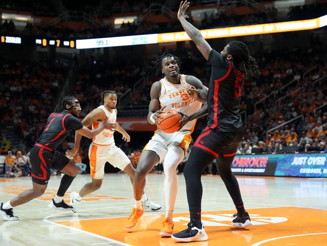 Tennessee forward Felix Okpara (34) looks for an open shot while guarded by Gardner-Webb forward Ademide Badmus (5) during an NCAA college basketball game on Monday, Nov. 4, 2024, in Knoxville, Tenn.