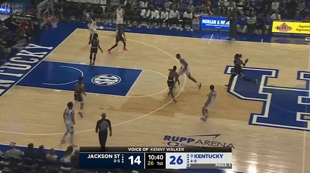 Jackson State's Dylan Canoville (right, dark jersey) seen as he throws a shoe at the ball