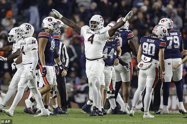 Texas A&M's Shemar Stewart (4) celebrates a missed field goal during the second half of an NCAA college football game against Auburn, Saturday, Nov. 23