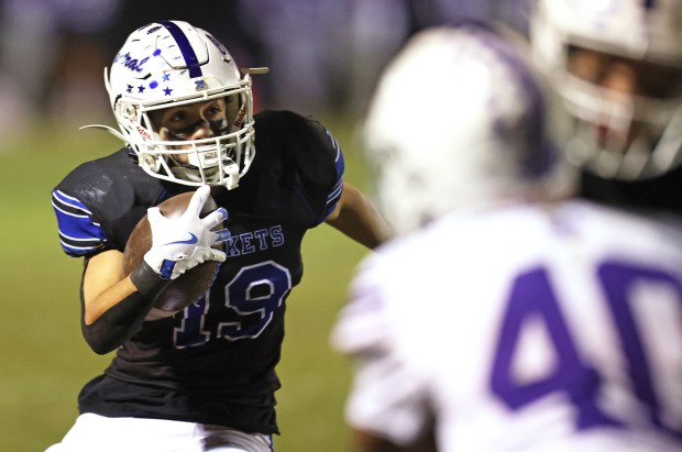 Burlington Central's Henry Deering (19) cuts left for a 33 yard TD run in the fourth quarter against Hampshire during a Fox Valley Conference game in Burlington on Friday, Oct. 18, 2024.(H. Rick Bamman / The Beacon-News)