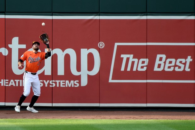 Orioles left fielder Colton Cowser catches a fly ball on the warning track in the eighth inning against the San Diego Padres at Orioles Park at Camden Yards. (Kim Hairston/Staff)