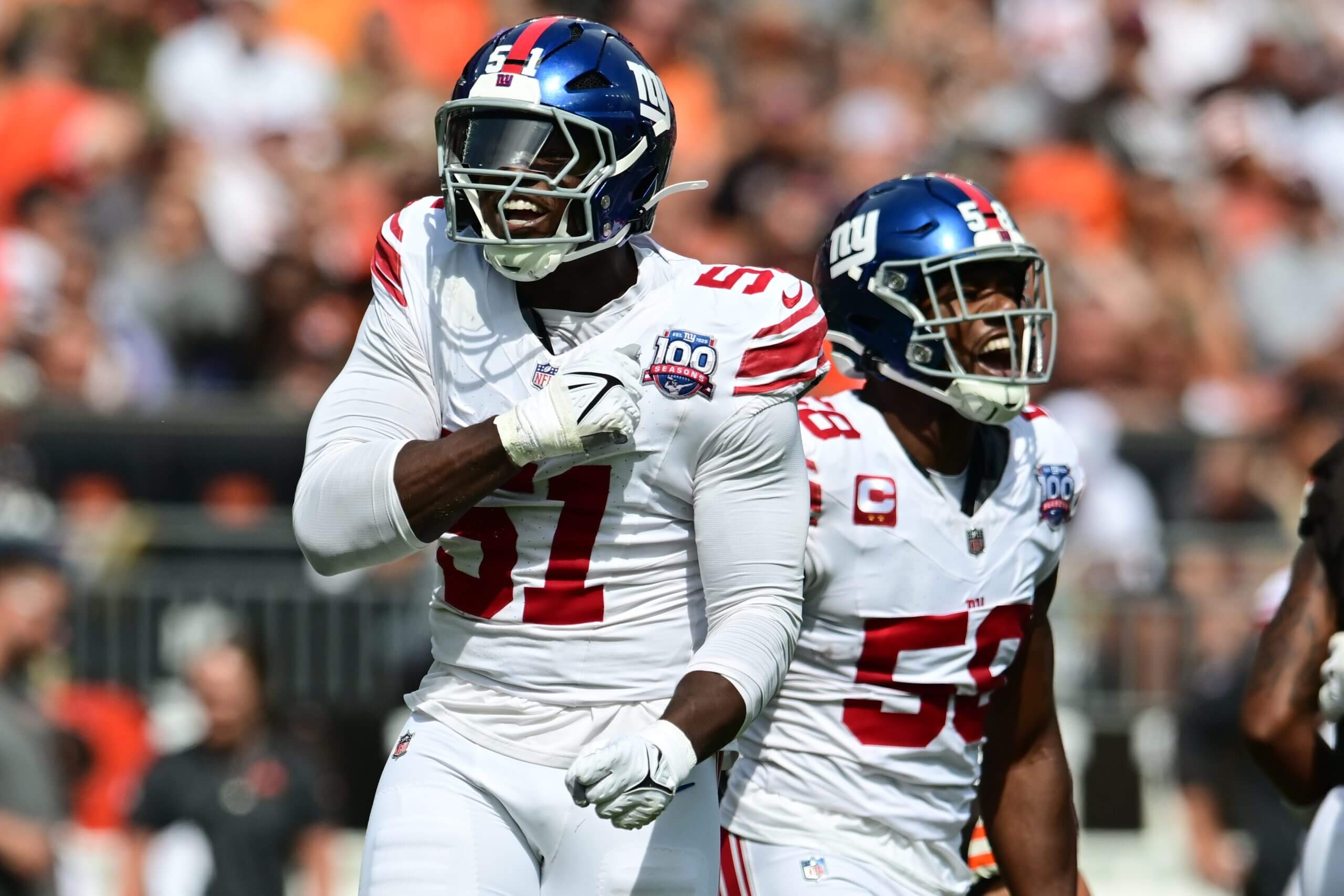 New York Giants linebacker Bobby Okereke and New York Giants linebacker Azeez Ojulari celebrate after a sack during the first quarter against the Cleveland Browns at Huntington Bank Field.