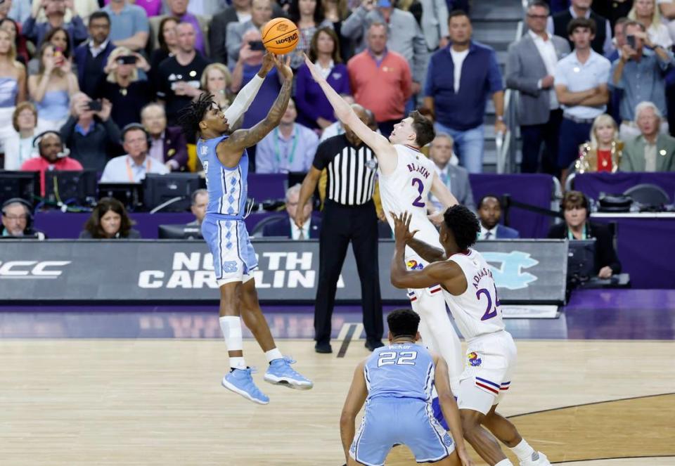 North Carolina’s Caleb Love (2) tries to hit a three-pointer as time runs out in Kansas’ 72-69 victory over UNC in the NCAA Men’s National Championship at the Caesars Superdome in New Orleans, La., Monday, April 4, 2022.
