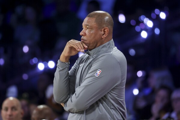 Milwaukee Bucks head coach Doc Rivers watches his team play during the first half of the championship game against the Oklahoma City Thunder in the NBA Cup basketball tournament Tuesday, Dec. 17, 2024, in Las Vegas. (AP Photo/Ian Maule)