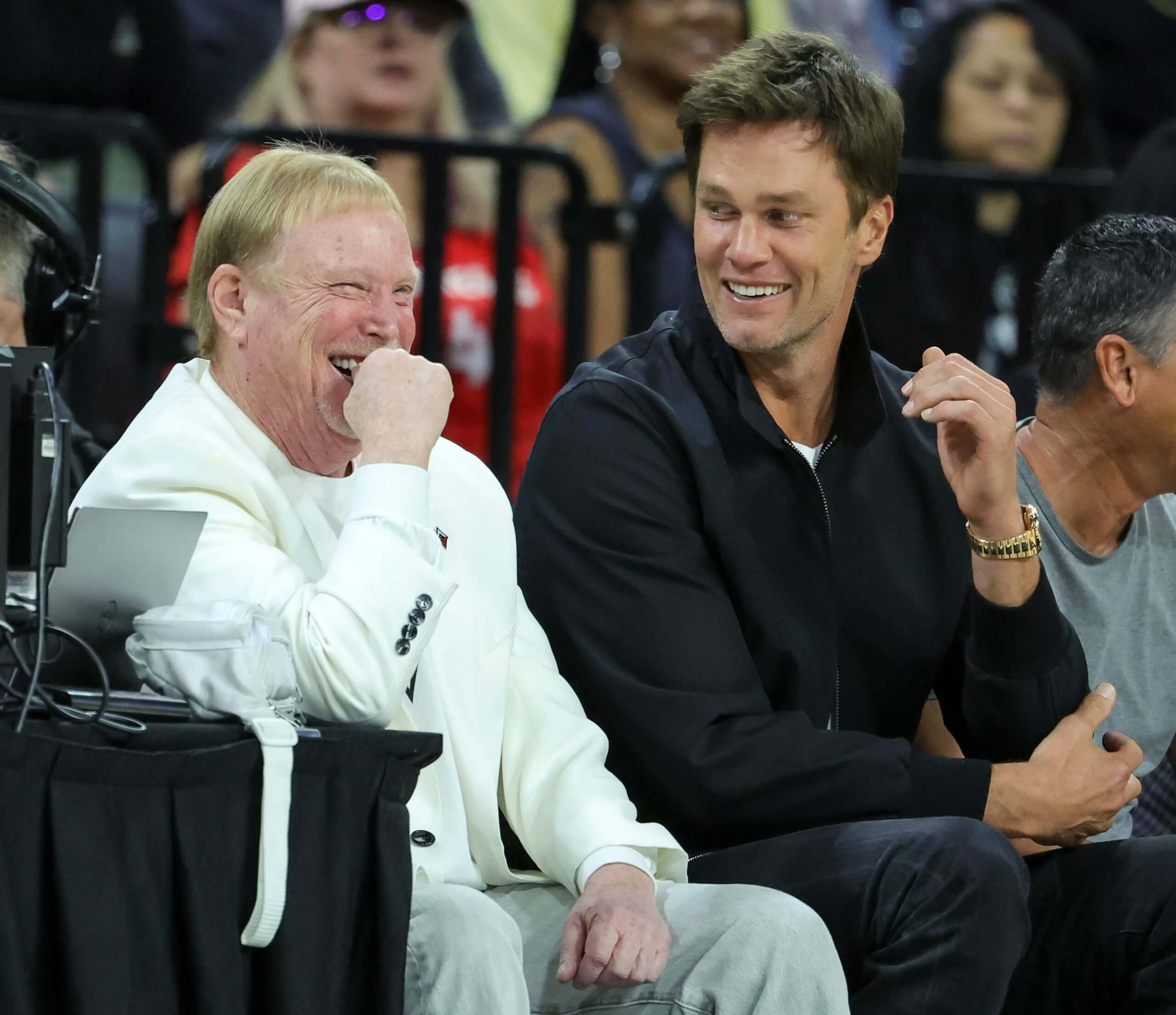 Las Vegas Raiders owner and managing general partner and Las Vegas Aces owner Mark Davis and Tom Brady laugh as they attend Game One of the 2023 WNBA Playoffs finals between the Aces and the New York Liberty at Michelob ULTRA Arena on October 08, 2023 in Las Vegas, Nevada.