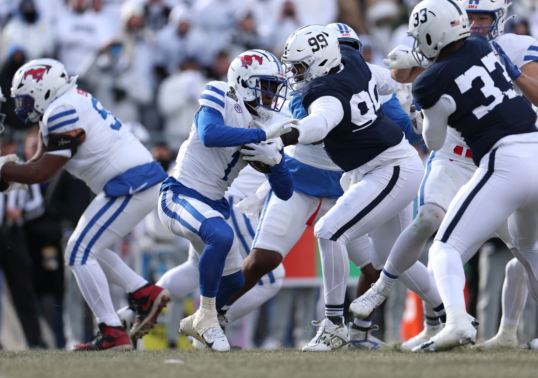 STATE COLLEGE, PENNSYLVANIA - DECEMBER 21: Brashard Smith #1 of the Southern Methodist Mustangs runs the ball during the first quarter against the Penn State Nittany Lions in the Playoff First Round Game at Beaver Stadium on December 21, 2024 in State College, Pennsylvania. (Photo by Scott Taetsch/Getty Images)