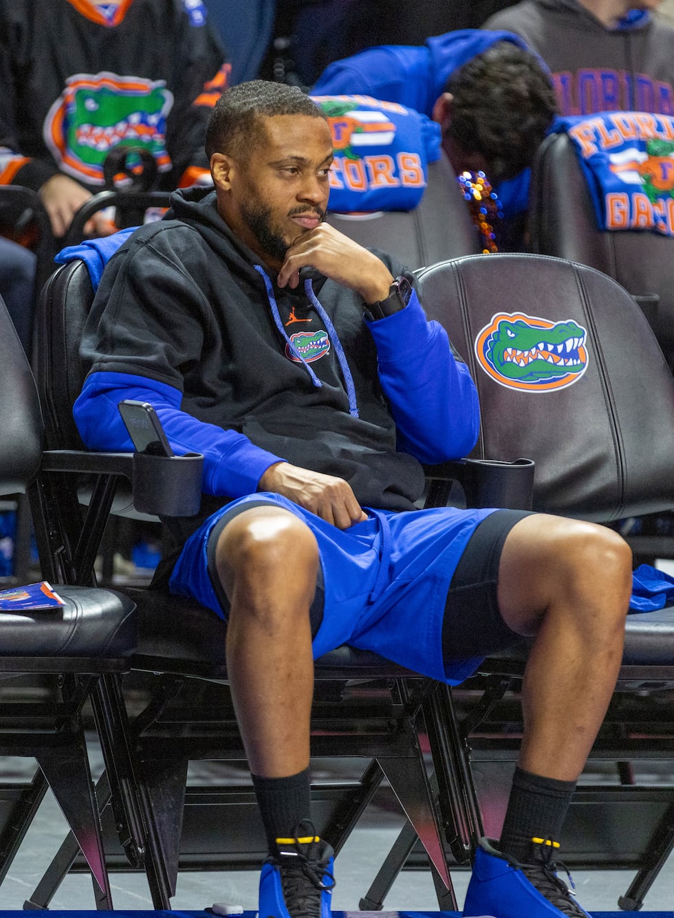 Florida assistant coach Taurean Green watches the team warm up before an NCAA college...