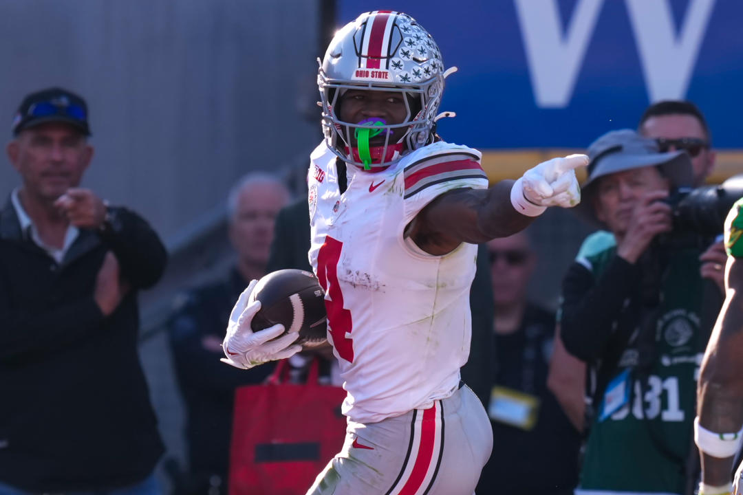 LOS ANGELES, CA - JANUARY 1: Jeremiah Smith #4 of the Ohio State Buckeyes touchdown celebration during a game between Ohio State Buckeyes and Oregon Ducks at Rose Bowl Stadium on January 1, 2025 in Los Angeles, California. (Photo by Melinda Meijer/ISI Photos/Getty Images)