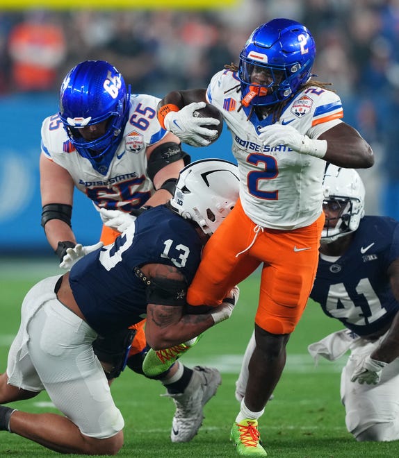 Boise State running back Ashton Jeanty (2) rushes the ball against Penn State during the first half of the Fiesta Bowl at State Farm Stadium.