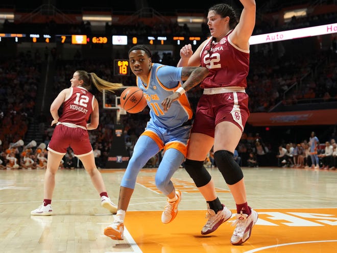 Tennessee's Zee Spearman (11) tries to get to the basket while guarded by Oklahoma's Raegan Beers (52) in an NCAA college basketball game on Sunday, Jan. 5, 2025 in Knoxville, Tenn.