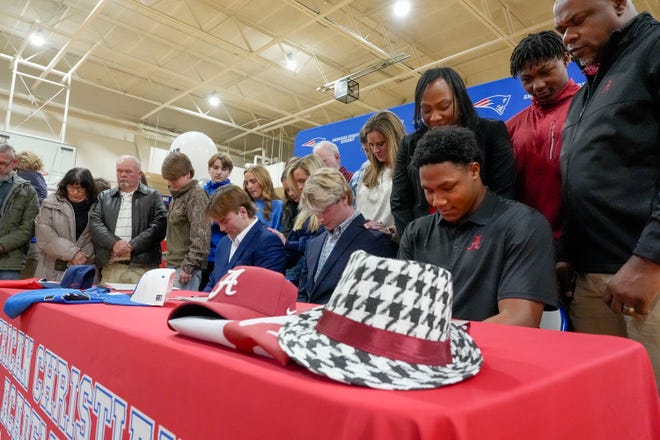 Evan Lightsey, Eric Hines and Cade Durrett signed to play baseball at the college level at ACA Tuesday, Jan. 9, 2025. Lightsey signed with Northwest Mississippi, Durrett at Bevill State, and Hines will play at the University of Alabama. The families of each athlete pray with them during the ceremony.