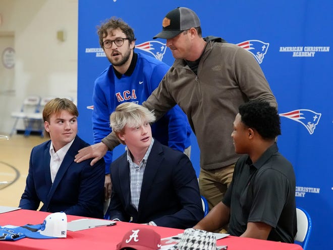 ACA baseball coach Del Howell, right, and Austin Grammer, left, talk to three of players who signed to play baseball at the college level at ACA Tuesday, Jan. 9, 2025. Eric Hines signed with Alabama, Cade Durrett signed at Bevill State, and Eric Lightsey singed at Nortwest Mississippi.