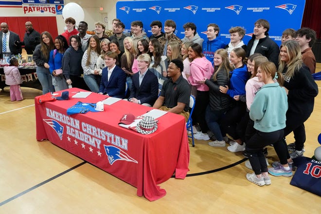 Evan Lightsey, Eric Hines and Cade Durrett signed to play baseball at the college level at ACA Tuesday, Jan. 9, 2025. Lightsey signed with Northwest Mississippi, Durrett at Bevill State, and Hines will play at the University of Alabama. They pose with members of the senior class during the signing ceremony.