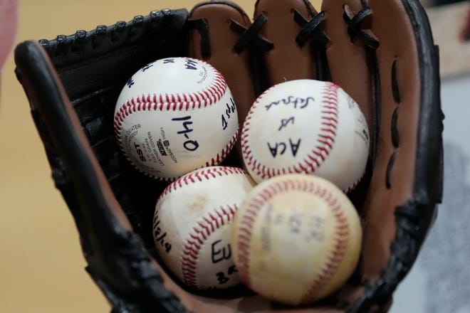 A collection of baseballs grace Evan Lightsey’s dispaly at ACA. He signed to play baseball at Northwest Mississippi at ACA Tuesday, Jan. 9, 2025.