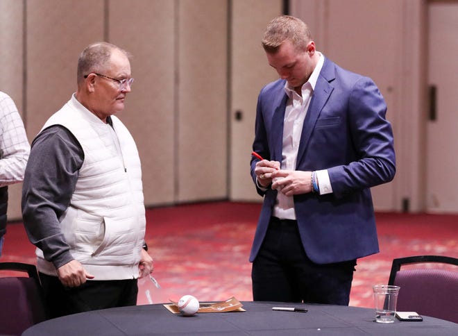 Josh Jung of the Texas Rangers signs autographs during a meet and greet during the College Baseball Foundation's First Pitch Luncheon, Thursday, Jan. 23, 2025, at the Lubbock Civic Center.