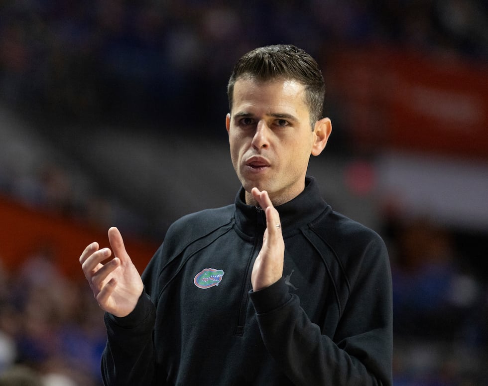 Florida head coach Todd Golden reacts during the first half of an NCAA college basketball game...