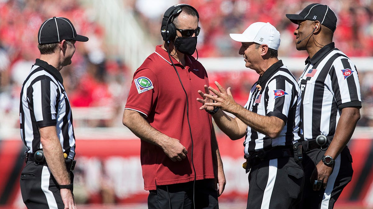 Nick Rolovich coaches against the Utah Utes