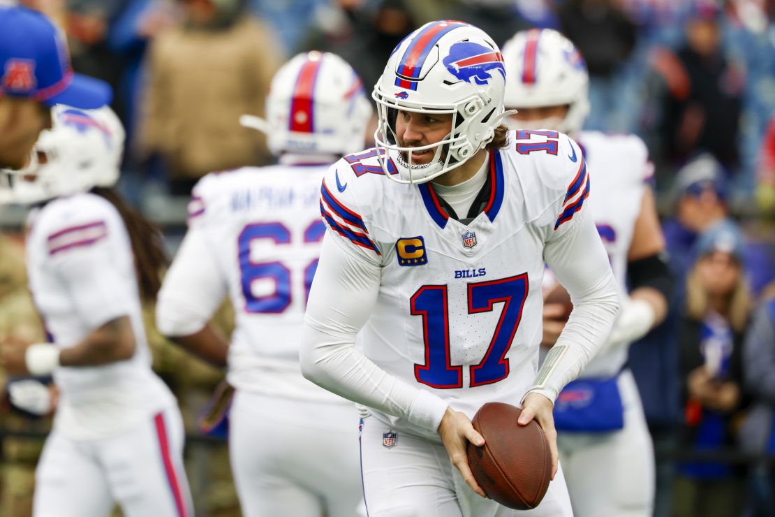 Buffalo Bills quarterback Josh Allen (17) takes a snap prior to an NFL football game against the New England Patriots, Sunday, Jan. 5, 2025, in Foxborough, Mass. (AP Photo/Greg M. Cooper)