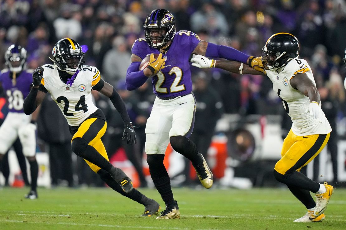 Ravens running back Derrick Henry breaks away from Steelers linebacker Patrick Queen and cornerback Joey Porter Jr. on his way to scoring a rushing touchdown.