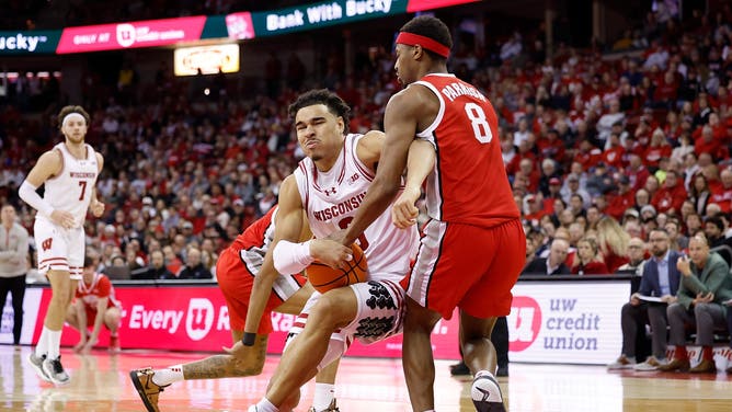 MADISON, WISCONSIN - JANUARY 14: John Tonje #9 of the Wisconsin Badgers drives to the basket during the second half of the game on Micah Parrish #8 of the Ohio State Buckeyes at Kohl Center on January 14, 2025 in Madison, Wisconsin. (Photo by John Fisher/Getty Images)