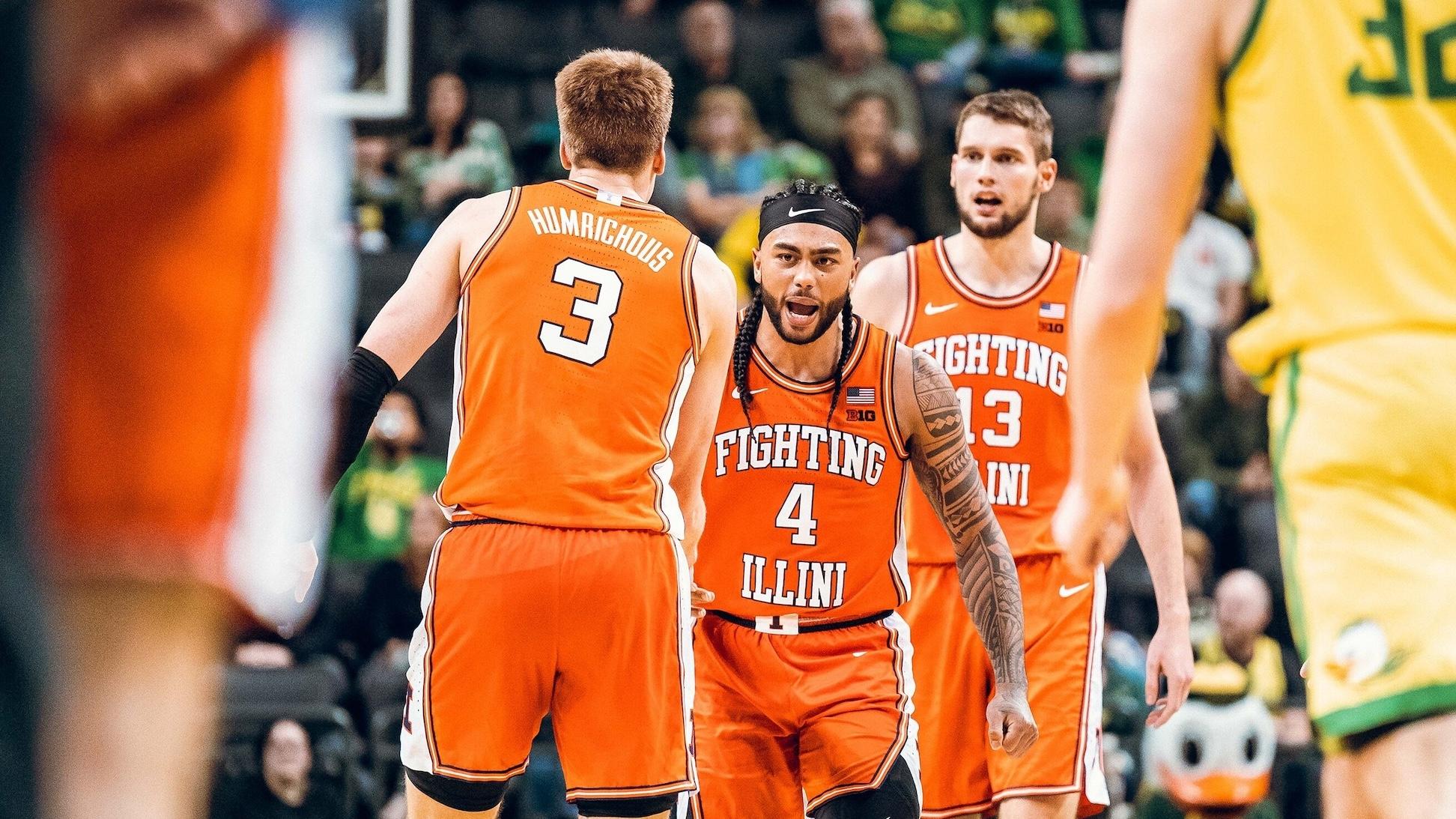 Illinois teammates get excited in game versus Oregon