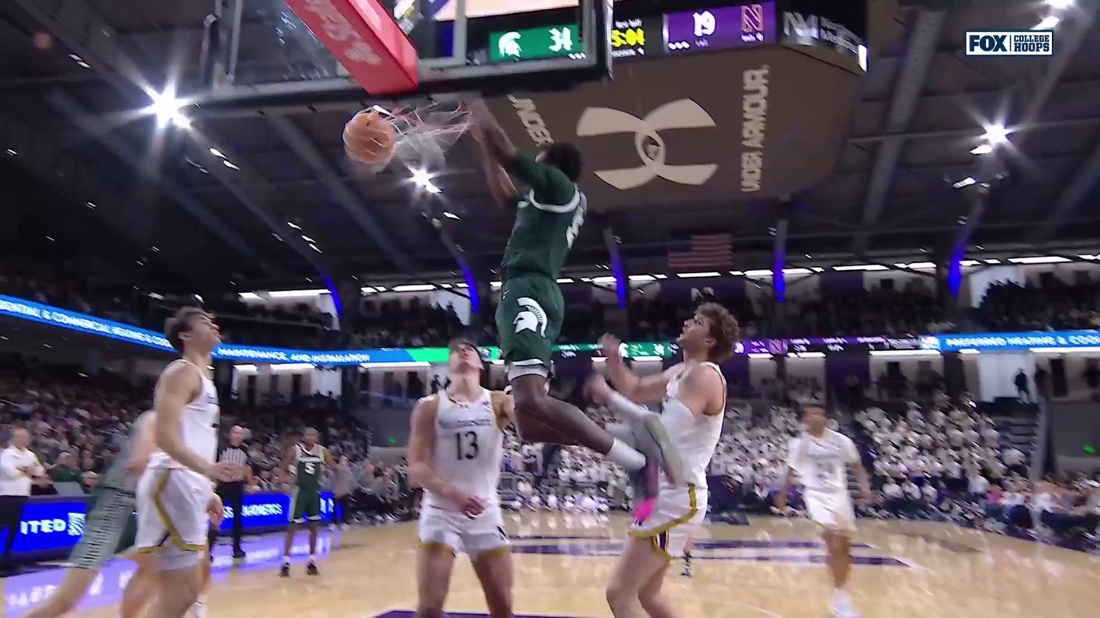 Coen Carr throws down a dunk, extending Michigan State's lead over Northwestern