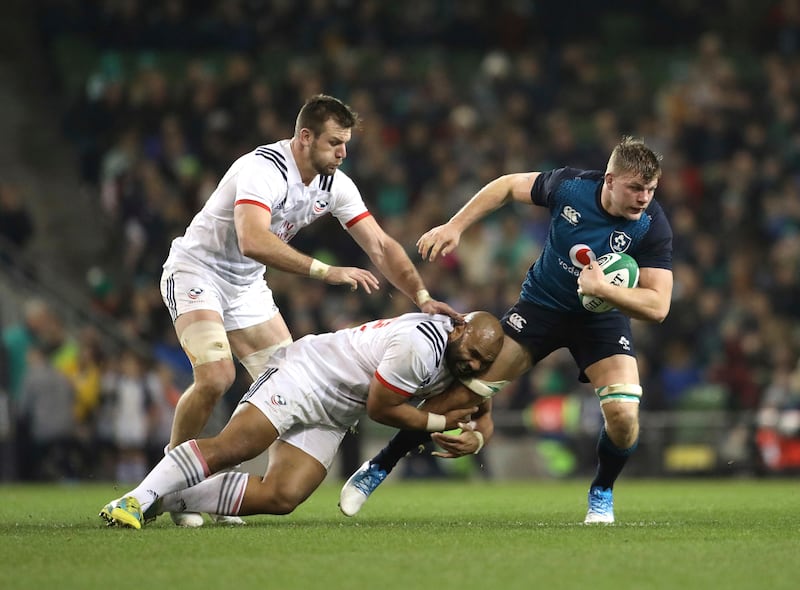 Ireland's Jordi Murphy, right, is tackled by USA's Paul Lasike and Shaun Davies during their Rugby Union International at the Aviva Stadium, Dublin, Ireland, Saturday, Nov 24, 2018.