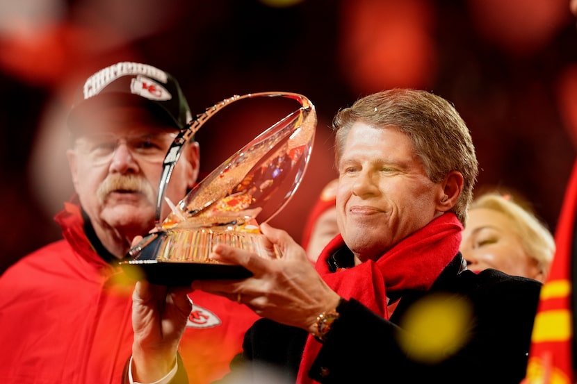 Kansas City Chiefs owner Clark Hunt holds the Lamar Hunt Trophy after the Chiefs defeated...