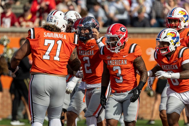 American team quarterback Jaxson Dart of Ole Miss (2) celebrates his touchdown with teammates during the first half of the 2025 Senior Bowl football game against the National team at Hancock Whitney Stadium.