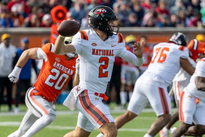 National team quarterback Tyler Shough of Louisville (2) throws the ball on the run against the American team during the first half at Hancock Whitney Stadium.